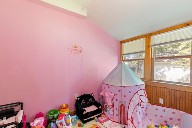 3114 Russell Ave N, Minneapolis, MN 55411 - bedroom with multiple windows, vaulted ceiling, and wood walls