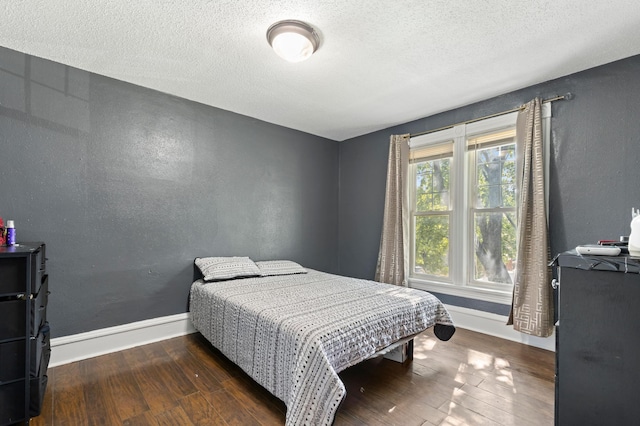 3114 Russell Ave N, Minneapolis, MN 55411 - bedroom featuring wood-type flooring and a textured ceiling