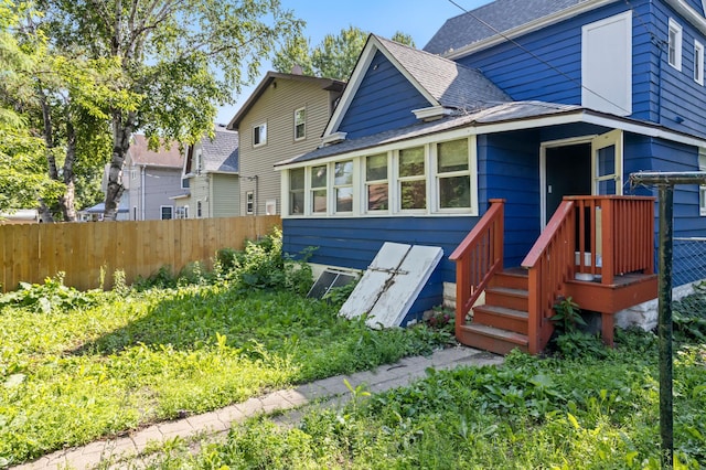 3114 Russell Ave N, Minneapolis, MN 55411 - rear view of house featuring a shingled roof
