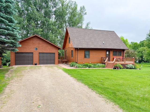34002 Fiske View Dr, Underwood, MN 56586 - log cabin featuring an outbuilding, a shingled roof, a front lawn, a garage, and a deck