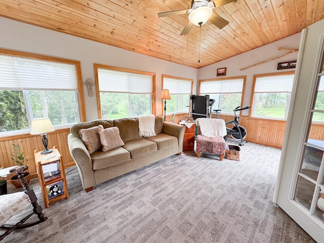 34002 Fiske View Dr, Underwood, MN 56586 - living room with carpet floors, vaulted ceiling, wood walls, a ceiling fan, and wood ceiling