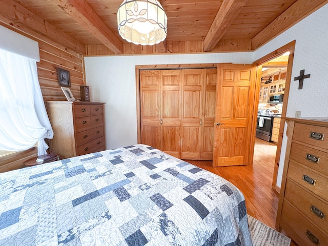 34002 Fiske View Dr, Underwood, MN 56586 - bedroom featuring wallpapered walls, a wood ceiling with exposed beams, light wood-type flooring, a closet, and rustic walls
