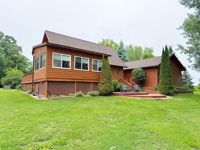 34002 Fiske View Dr, Underwood, MN 56586 - rear view of property with a yard, faux log siding, roof with shingles, and a wooden deck