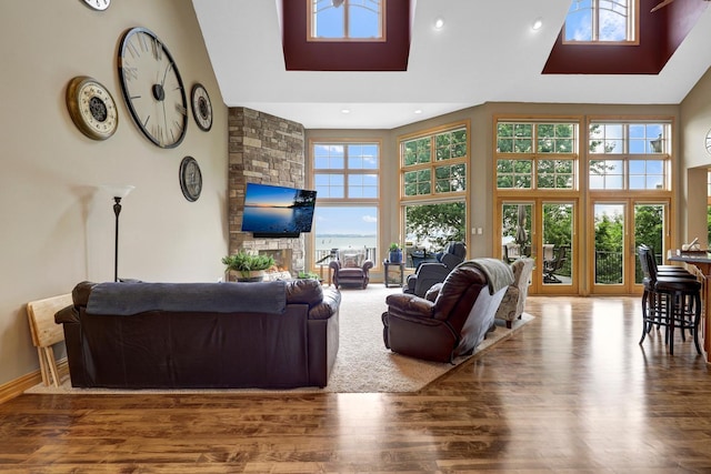 22620 Hayward Ave N, Forest Lake, MN 55025 - living room featuring high vaulted ceiling, wood finished floors, and recessed lighting