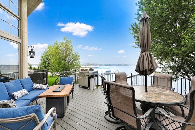 22620 Hayward Ave N, Forest Lake, MN 55025 - deck featuring an outdoor living space with a fire pit, outdoor dining area, a water view, and a grill