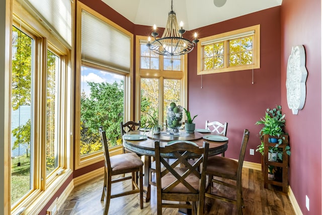 22620 Hayward Ave N, Forest Lake, MN 55025 - dining space with healthy amount of natural light, a chandelier, and wood finished floors