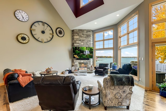 22620 Hayward Ave N, Forest Lake, MN 55025 - living room with a high ceiling, plenty of natural light, wood finished floors, a fireplace, and recessed lighting