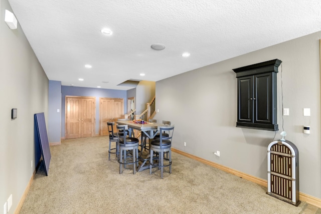 22620 Hayward Ave N, Forest Lake, MN 55025 - dining space featuring light carpet, stairway, recessed lighting, and a textured ceiling