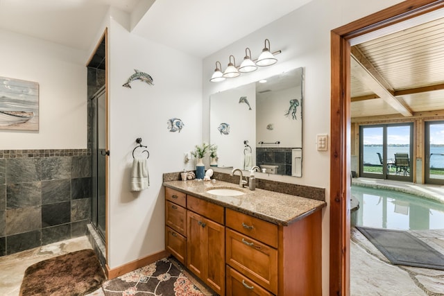 22620 Hayward Ave N, Forest Lake, MN 55025 - bathroom with vanity, a water view, a stall shower, and beam ceiling