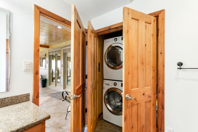 22620 Hayward Ave N, Forest Lake, MN 55025 - laundry area with stacked washer and clothes dryer and wooden ceiling