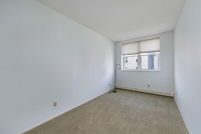 215 7th St NE Unit 205, Minneapolis, MN 55413 - unfurnished room with a baseboard heating unit and carpet