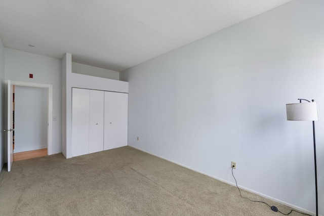 215 7th St NE Unit 205, Minneapolis, MN 55413 - unfurnished bedroom with carpet and a closet