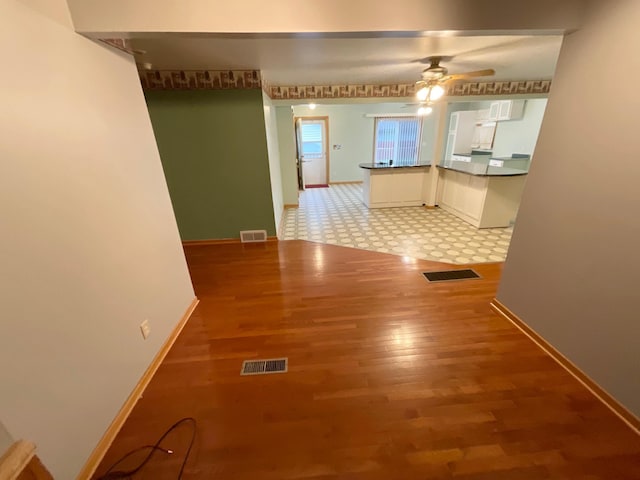 108 Johnson St NE, Brownsdale, MN 55918 - unfurnished dining area featuring a ceiling fan and light wood finished floors