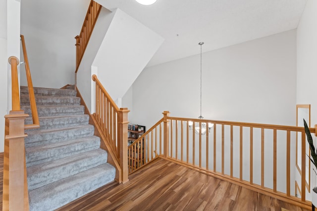 15588 Early Bird Cir Unit 1704, Apple Valley, MN 55124 - stairs featuring wood finished floors and a chandelier