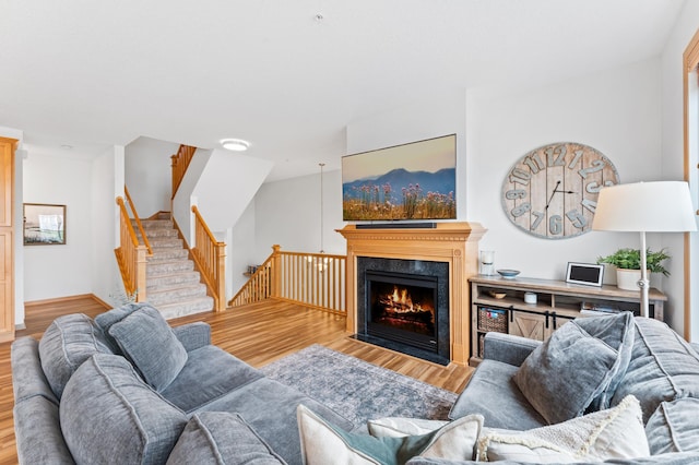 15588 Early Bird Cir Unit 1704, Apple Valley, MN 55124 - living area with wood finished floors, a high end fireplace, and stairway