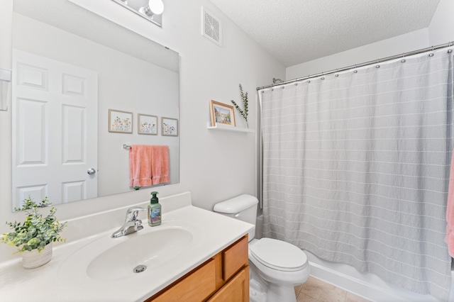 15588 Early Bird Cir Unit 1704, Apple Valley, MN 55124 - bathroom with vanity, a textured ceiling, tile patterned flooring, and shower / tub combo