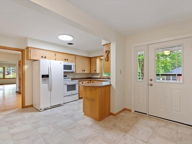 517 Cedar St, Brainerd, MN 56401 - kitchen with white appliances, healthy amount of natural light, and a peninsula
