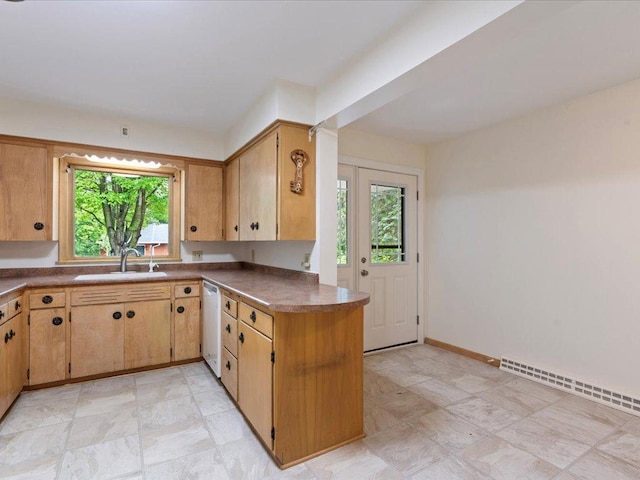 517 Cedar St, Brainerd, MN 56401 - kitchen featuring plenty of natural light, dark countertops, dishwasher, and a baseboard heating unit
