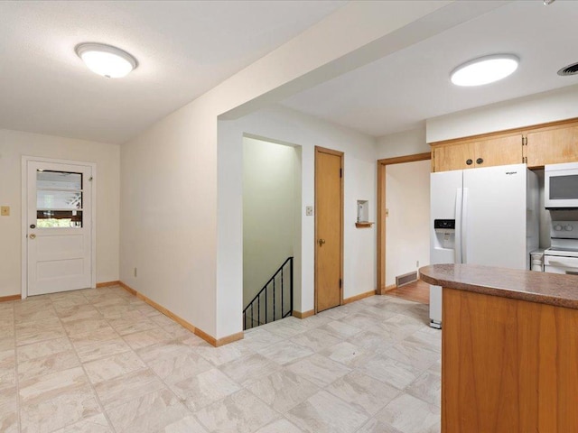 517 Cedar St, Brainerd, MN 56401 - kitchen with white appliances and baseboards