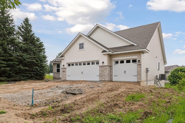 1096 Prospect Pointe Rd, Jordan, MN 55352 - view of front of home with a shingled roof, stone siding, board and batten siding, and a garage