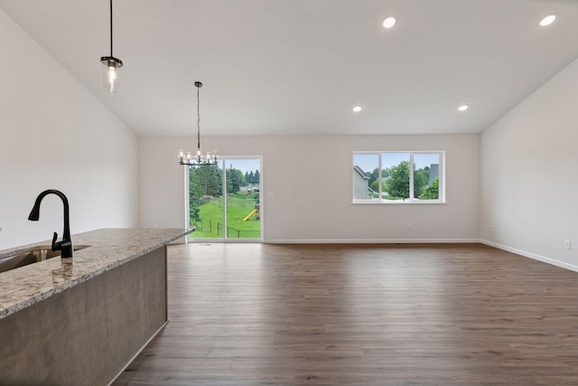 1096 Prospect Pointe Rd, Jordan, MN 55352 - kitchen with healthy amount of natural light, dark wood finished floors, hanging light fixtures, and recessed lighting