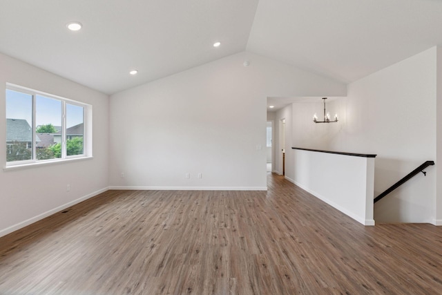 1096 Prospect Pointe Rd, Jordan, MN 55352 - empty room with a chandelier, wood finished floors, lofted ceiling, and recessed lighting