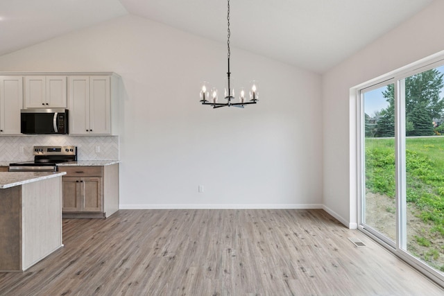 1096 Prospect Pointe Rd, Jordan, MN 55352 - kitchen with stainless steel appliances, lofted ceiling, a chandelier, decorative backsplash, and light wood-style floors
