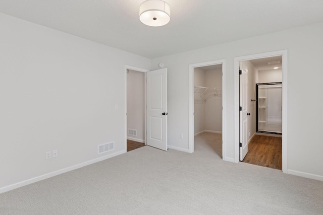 1096 Prospect Pointe Rd, Jordan, MN 55352 - unfurnished bedroom featuring carpet, a spacious closet, and a closet