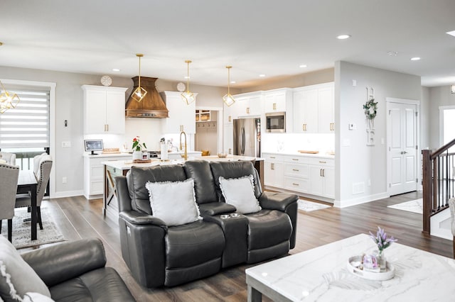 1205 Skyview Cir NW, Rochester, MN 55901 - living room featuring recessed lighting, dark wood-style flooring, stairs, and a chandelier