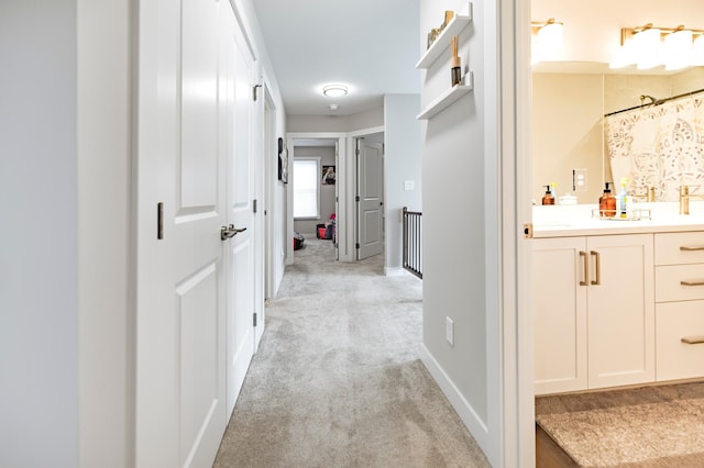 1205 Skyview Cir NW, Rochester, MN 55901 - corridor featuring light colored carpet and baseboards