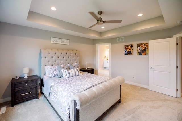 1205 Skyview Cir NW, Rochester, MN 55901 - bedroom featuring a tray ceiling, light colored carpet, recessed lighting, a ceiling fan, and ensuite bathroom