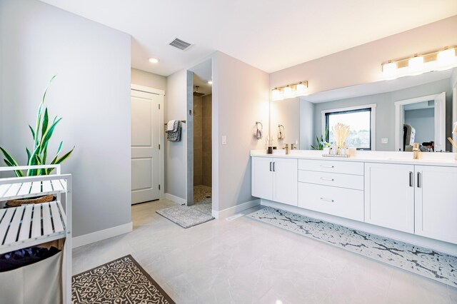 1205 Skyview Cir NW, Rochester, MN 55901 - full bath with double vanity, a tile shower, and recessed lighting