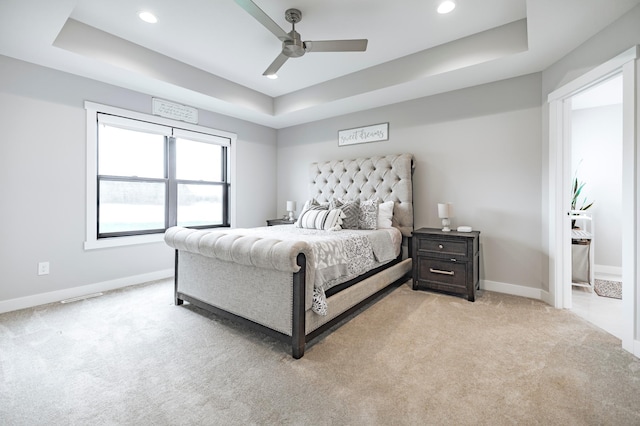 1205 Skyview Cir NW, Rochester, MN 55901 - bedroom with a tray ceiling, light carpet, recessed lighting, and ceiling fan