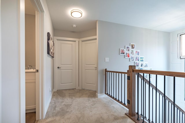 1205 Skyview Cir NW, Rochester, MN 55901 - corridor with light carpet and an upstairs landing