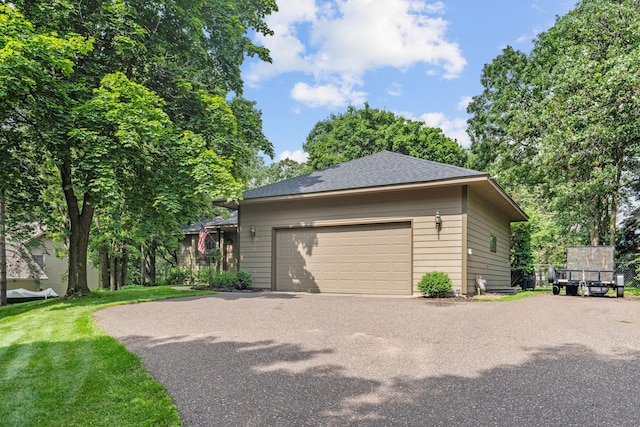 13790 Crane St NW, Andover, MN 55304 - view of home's exterior featuring asphalt driveway, a garage, and a shingled roof