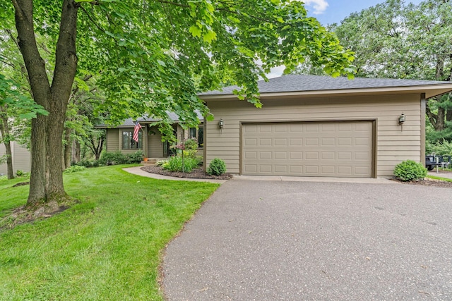 13790 Crane St NW, Andover, MN 55304 - view of front of house with asphalt driveway, a front lawn, and an attached garage