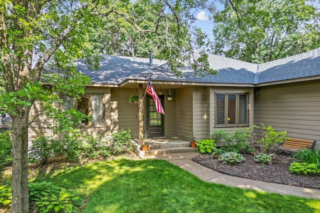 13790 Crane St NW, Andover, MN 55304 - view of front facade featuring a front yard and roof with shingles