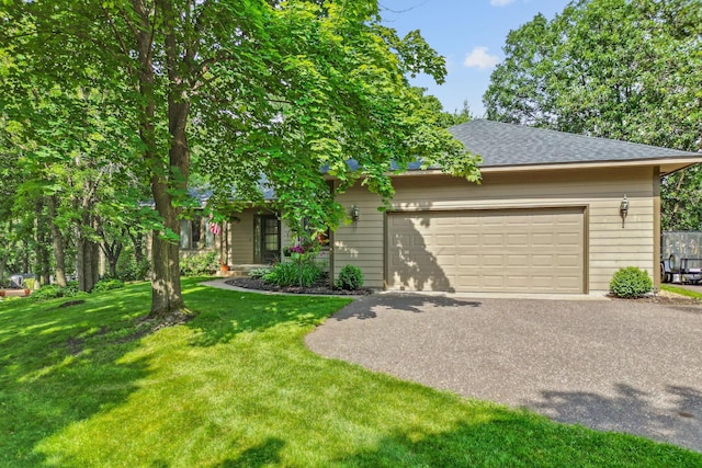 13790 Crane St NW, Andover, MN 55304 - obstructed view of property featuring an attached garage, asphalt driveway, a front yard, and a shingled roof