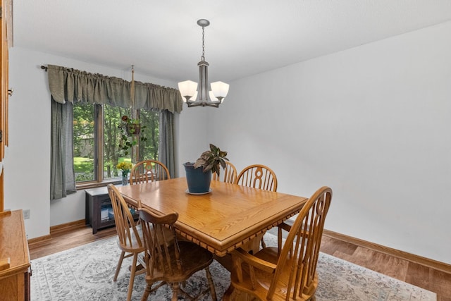 13790 Crane St NW, Andover, MN 55304 - dining area featuring a chandelier and wood finished floors
