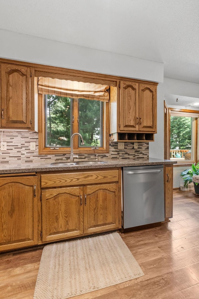 13790 Crane St NW, Andover, MN 55304 - kitchen featuring dishwasher, tasteful backsplash, light wood-style flooring, and plenty of natural light