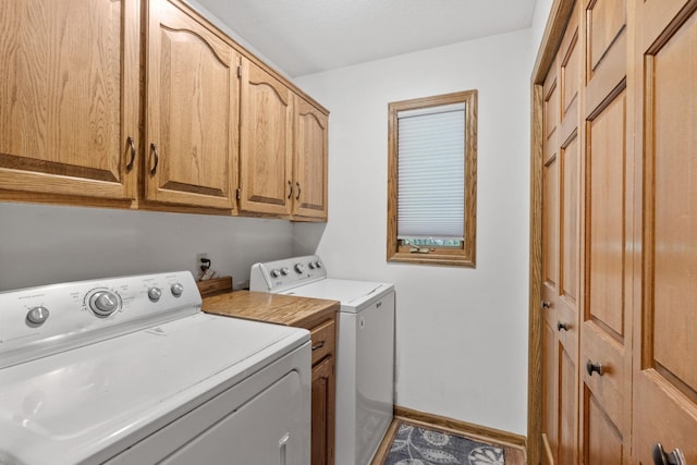 13790 Crane St NW, Andover, MN 55304 - laundry room featuring independent washer and dryer and cabinet space