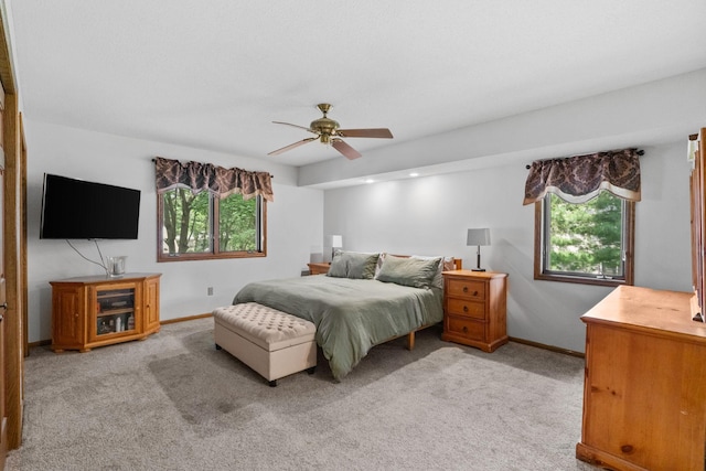 13790 Crane St NW, Andover, MN 55304 - bedroom with multiple windows, light carpet, and a ceiling fan