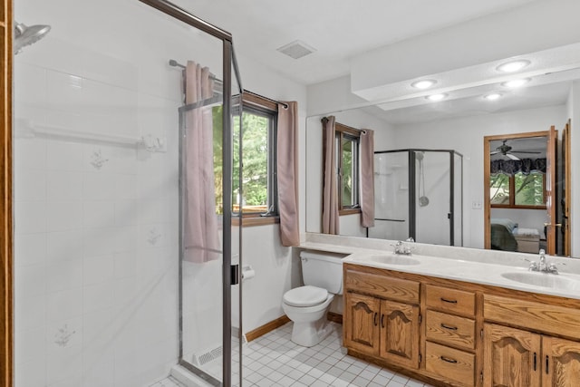 13790 Crane St NW, Andover, MN 55304 - ensuite bathroom featuring a shower stall, double vanity, and tile patterned floors