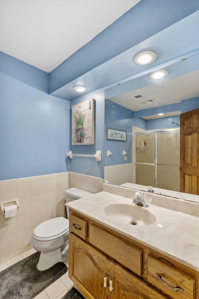 13790 Crane St NW, Andover, MN 55304 - full bath featuring vanity, a shower stall, tile patterned floors, recessed lighting, and a wainscoted wall
