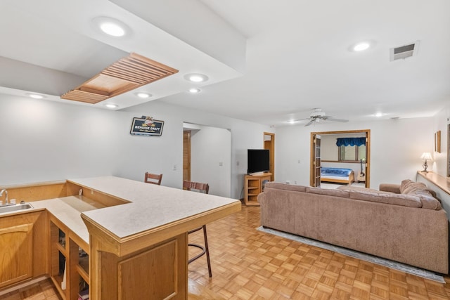 13790 Crane St NW, Andover, MN 55304 - kitchen with open floor plan, recessed lighting, a kitchen bar, light countertops, and ceiling fan
