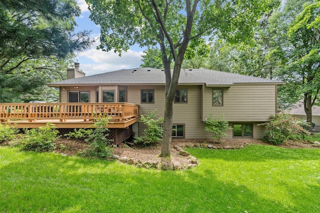 13790 Crane St NW, Andover, MN 55304 - rear view of house featuring a chimney, a deck, a lawn, and a shingled roof