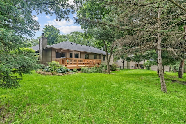 13790 Crane St NW, Andover, MN 55304 - rear view of house featuring a chimney, a wooden deck, a lawn, and a shingled roof