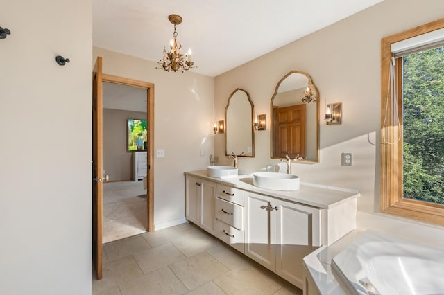 13845 Essex Trl, Apple Valley, MN 55124 - full bathroom featuring double vanity, a bathtub, a chandelier, and tile patterned flooring
