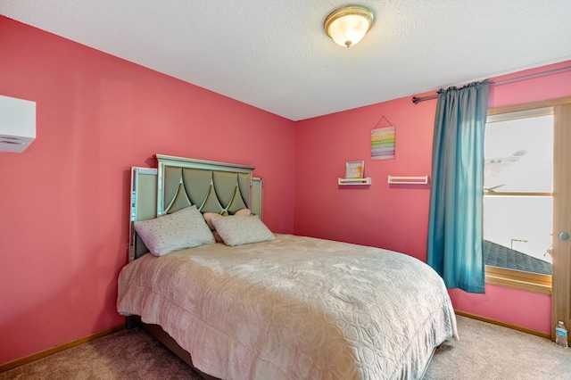 13845 Essex Trl, Apple Valley, MN 55124 - carpeted bedroom featuring a wall mounted AC and a textured ceiling