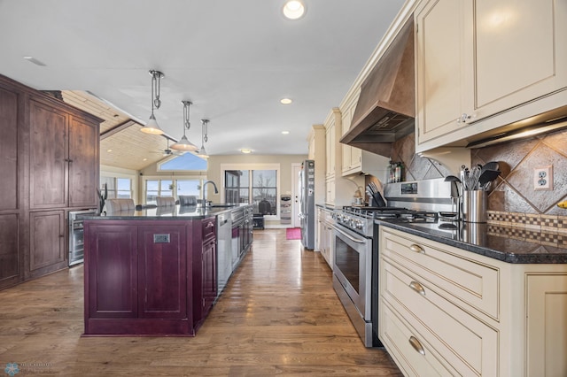 26097 156th Ave S, Tansem Twp, MN 56514 - kitchen with appliances with stainless steel finishes, wall chimney exhaust hood, dark wood-style flooring, backsplash, and lofted ceiling